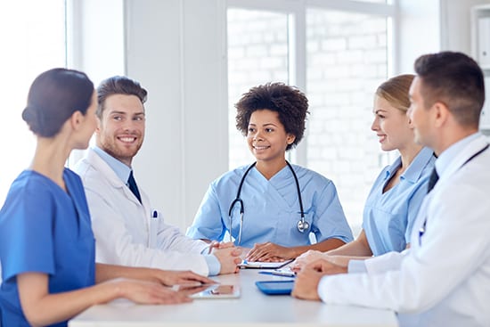 Group of Medical Professionals talk together